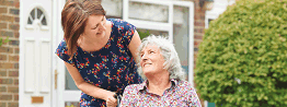 lady in wheel chair with carer